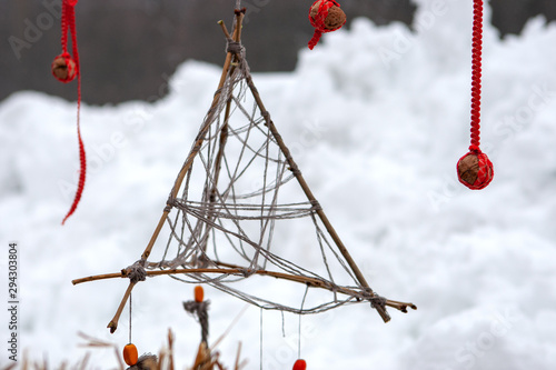 dream catcher amulet outdoors. asabikeshiinh ethnic symbol.