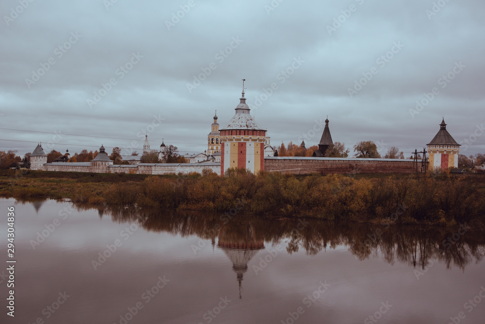 View of the Spassky Cathedral and the bell tower of the Spaso-Prilutsky monastery in Vologda from the rail road on a cloudy autumn day