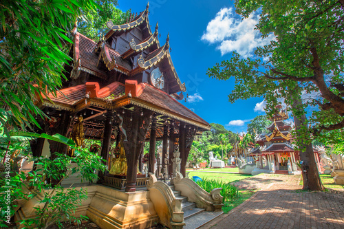 background,Open view of the temple at Dara Pirom Temple (Mae Rim),which has a large statue in front of the temple. Covered by trees and sky, Chiang Mai Province, Thailand, Wat Pa Daphirom photo