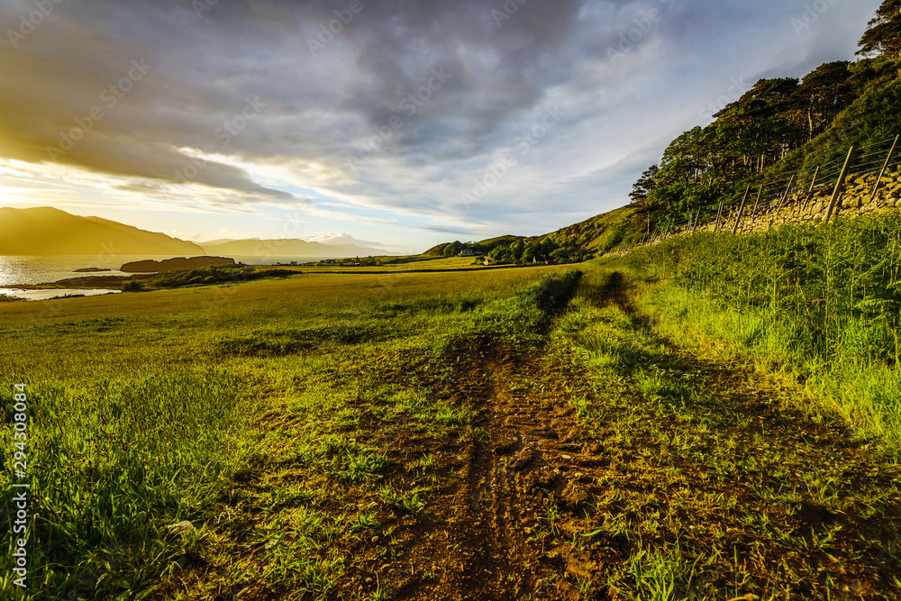 Fototapeta premium Beautiful scenic landscape of Scotland nature with beautiful evening sun set sky.