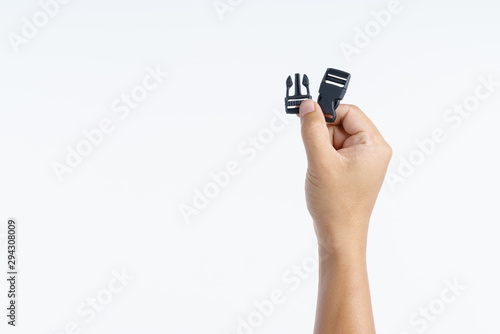 Hand holding clip lock strap
