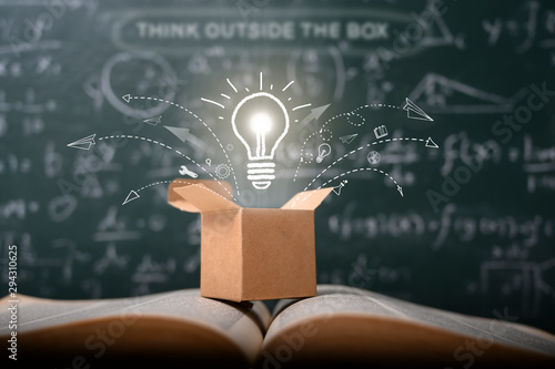 think outside the box on school green blackboard . startup  education concept. creative idea. leadership. photo