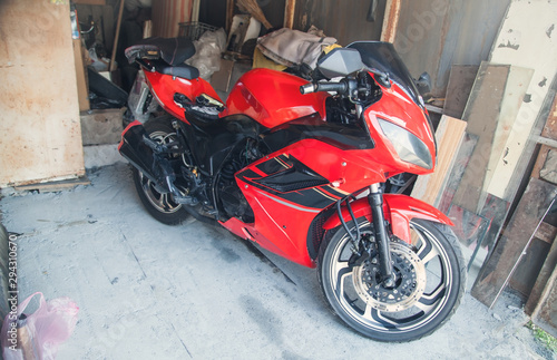 Red motorcycle in the garage. Speed