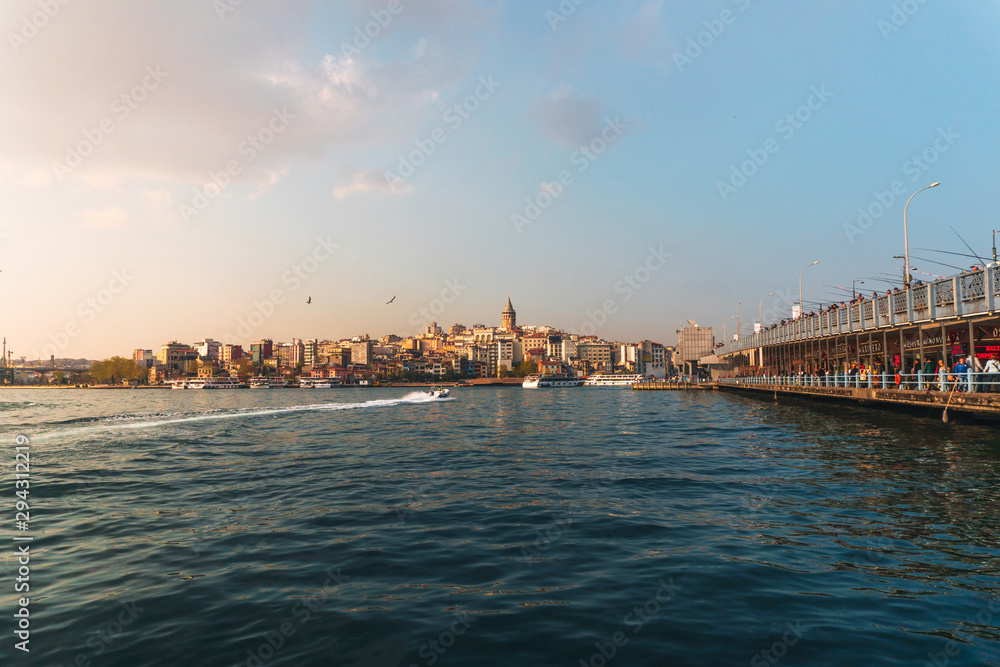 April 17, 2019 :View of Istanbul cityscape Galata Tower with floating tourist boats in Bosphorus ,Istanbul Turkey