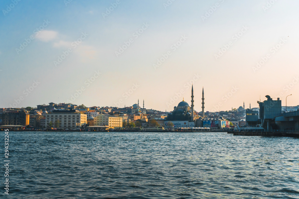 April 17, 2019 : View of Istanbul cityscape Suleymaniye Mosque Hagia Sophia with floating tourist boats in Bosphorus ,Istanbul Turkey