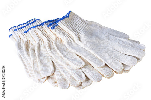 Many scattered new clean textile gloves for save hands on hard works or gardening isolated on white background. Close-up © OlekStock