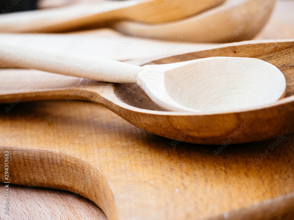Handmade wooden kitchen utensils. Spoons and wooden planks for Housewives Handmade wooden kitchen utensils. Spoons and wooden planks for Housewives