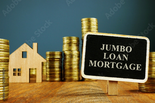 Canvas Print Jumbo Loan mortgage inscription and stacks of coins.