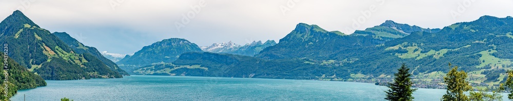 Panoramic view on green Swiss Alps near lake Lucerne