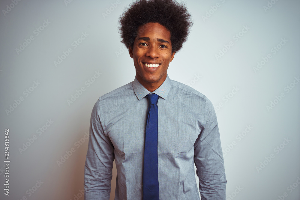 American business man with afro hair wearing shirt and tie over isolated white background with a happy and cool smile on face. Lucky person. American business man with afro hair wearing shirt and tie over isolated white background with a happy and cool smile on face. Lucky person.