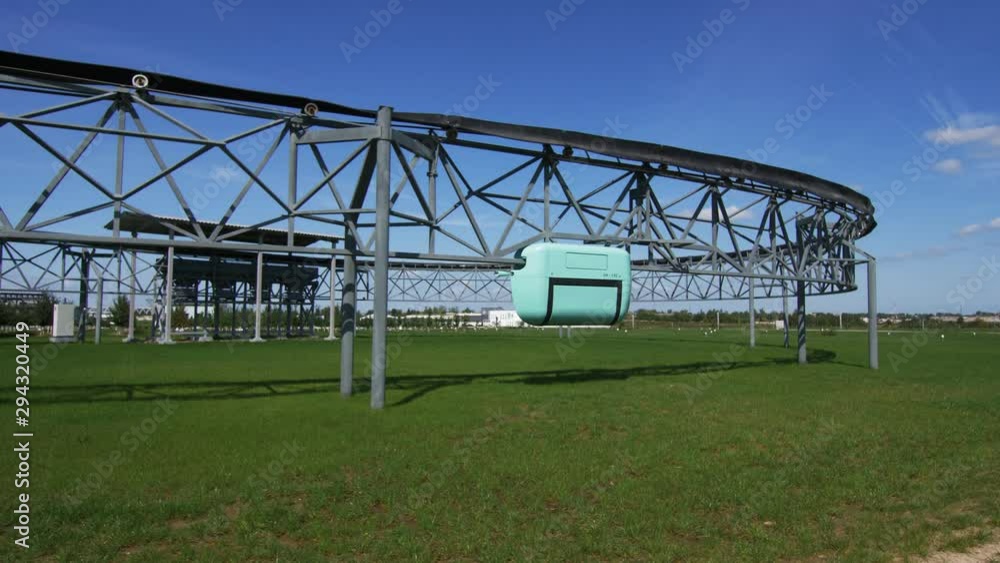 unitruck drives along overpass railway over green grass unitruck drives along overpass railway over green grass