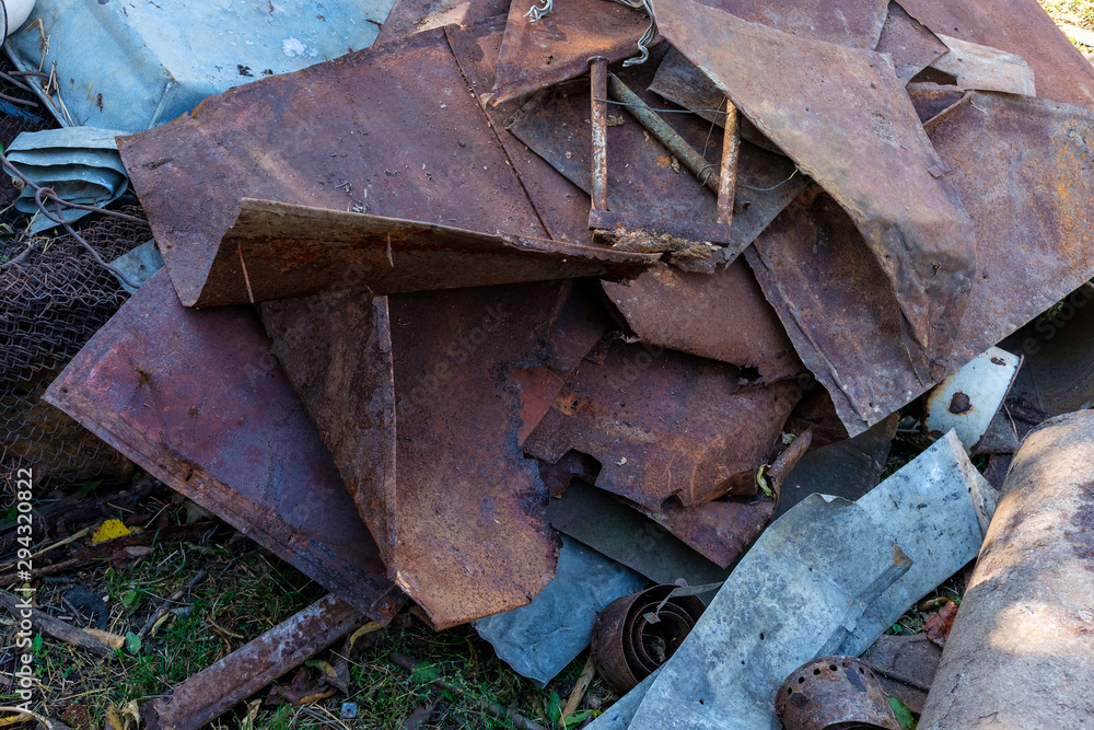 Bits of old rusty scrap metal lying in a heap