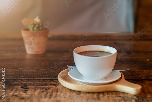 cup of coffee on wooden table