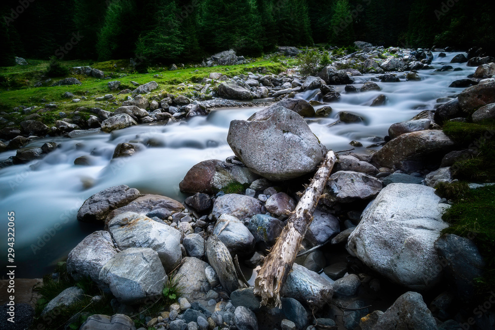 The flowing river Ruetz with stones and trees The flowing river Ruetz with stones and trees