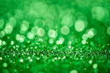 Green shiny glitters background. Green abstract texture.