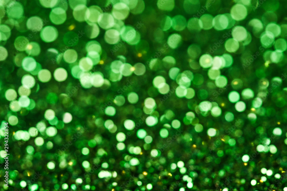 Obraz premium Green shiny glitters background. Green abstract texture.
