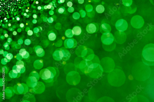 Green shiny glitters background. Green abstract texture.