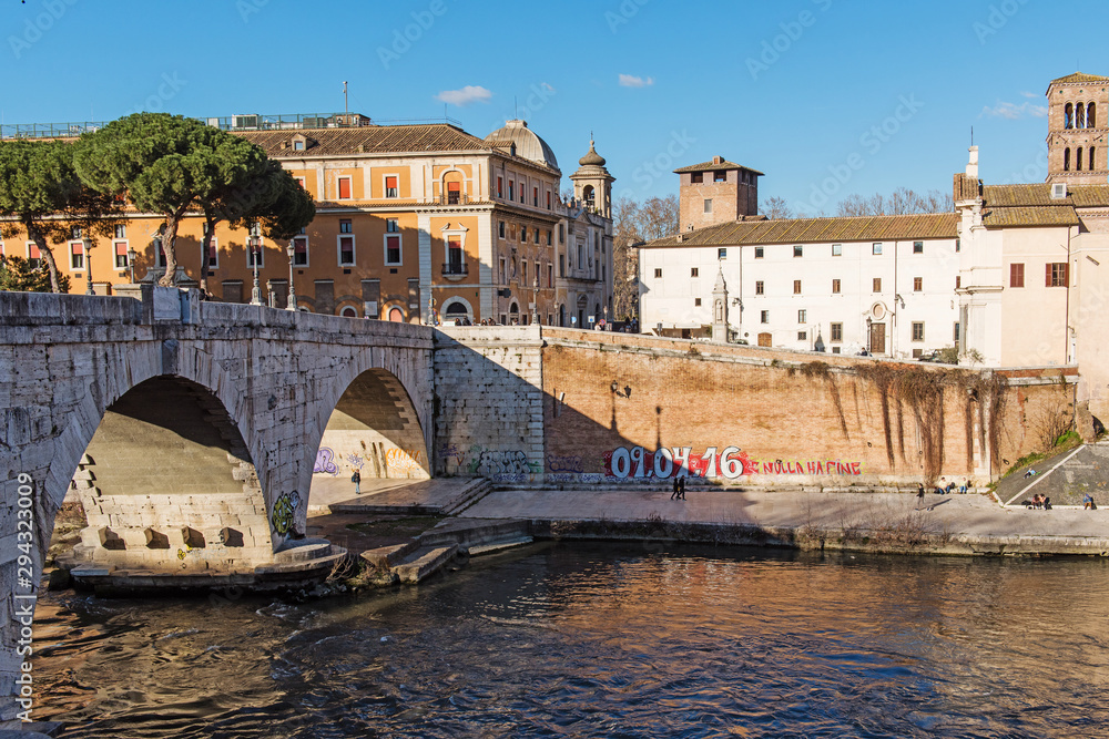 Riverfront view on Rome and stone bridge, Ponte Cestio on Tiber river in Rome. Italy