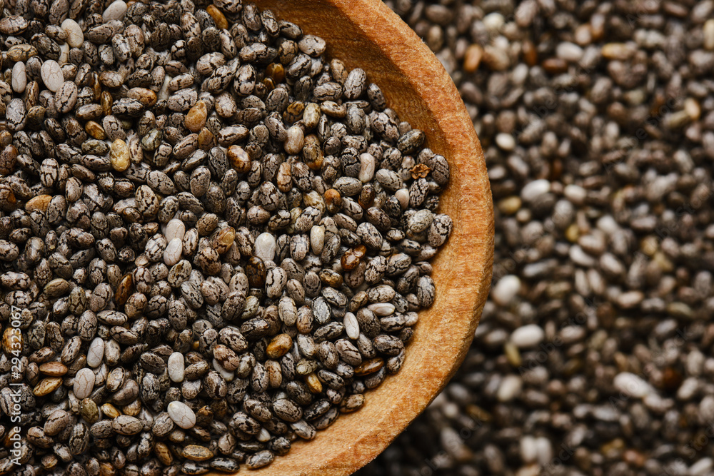 chia seeds in wooden spoon. chia seeds background chia seeds in wooden spoon. chia seeds background