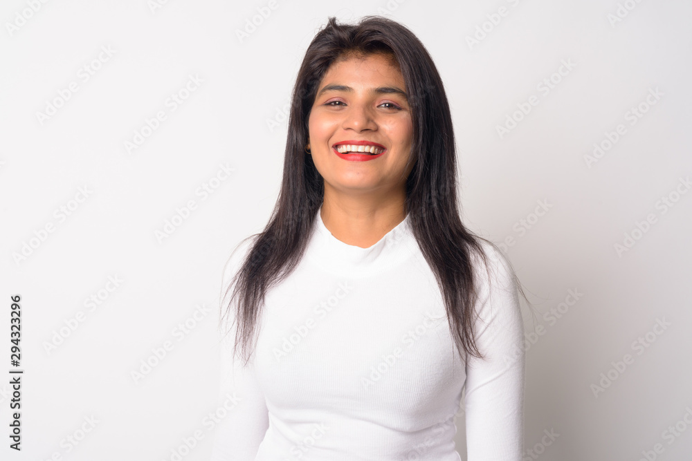 Happy young beautiful Persian woman smiling and looking at camera Happy young beautiful Persian woman smiling and looking at camera