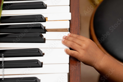 Wallpaper Mural Hand of kid on piano keyboard Torontodigital.ca