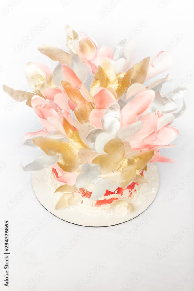 A wedding cake. Festive white cake with butterflies. A wedding cake. Festive white cake with butterflies.