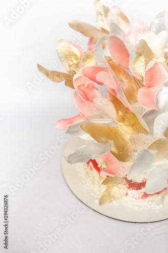 A wedding cake. Festive white cake with butterflies.