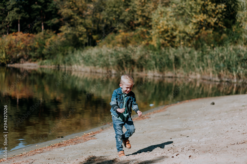 Portrait of cute smiling boy on a summer riverbank. Portrait of cute smiling boy on a summer riverbank.