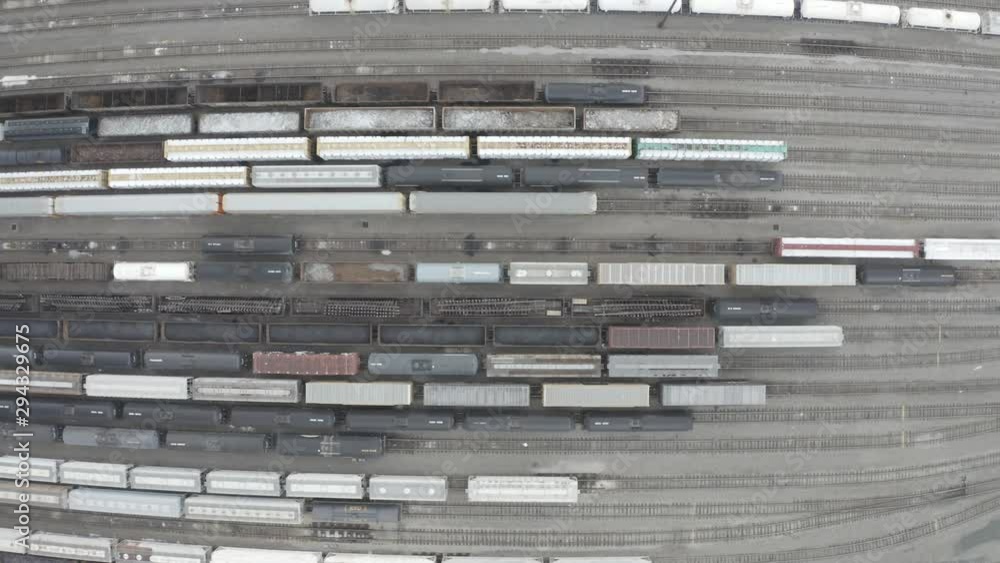 Top-down drone video of a train yard. Top-down drone video of a train yard.