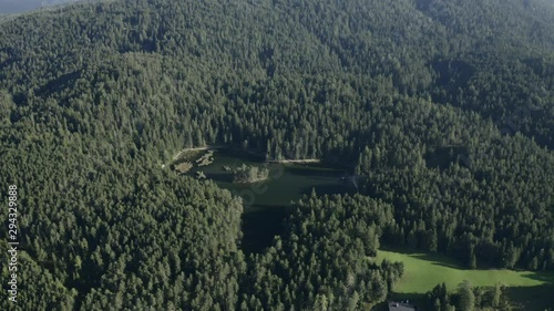 View of the möserer lake sorounded by trees photo