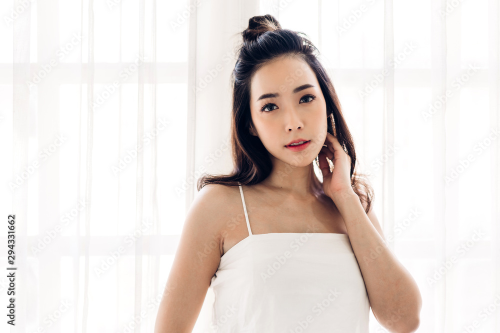 Portrait of fashion style smilling beautiful woman model posing on wall background Portrait of fashion style smilling beautiful woman model posing on wall background