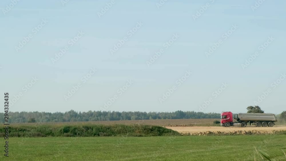 truck carrying dirt and gravel on a highway construction site truck carrying dirt and gravel on a highway construction site