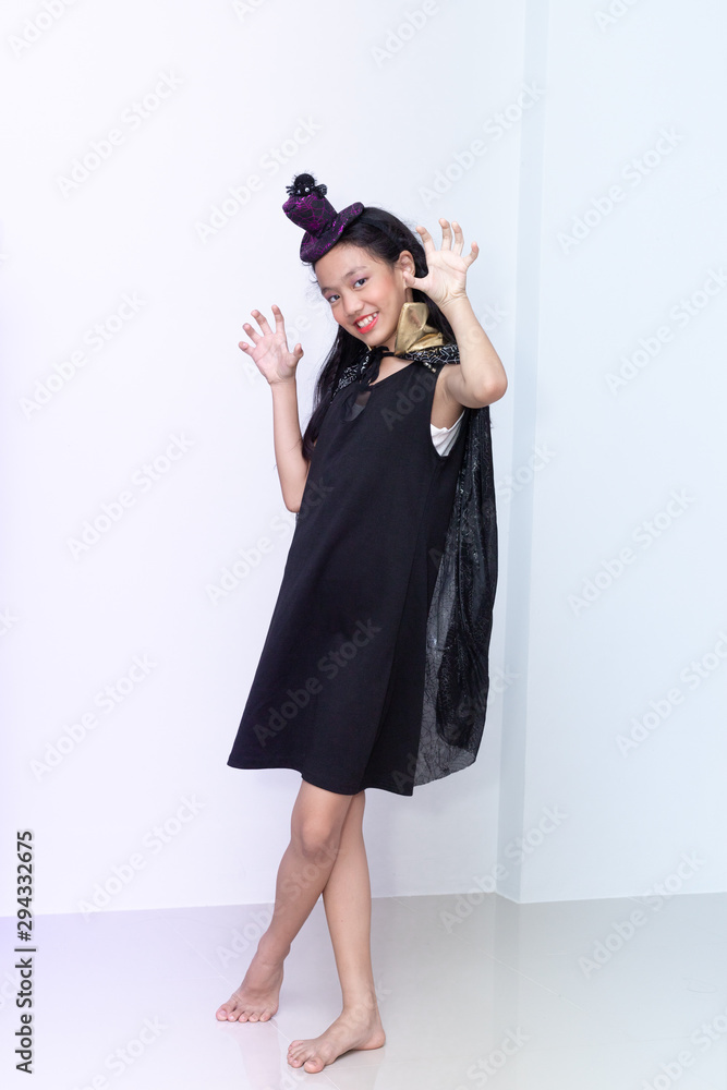 Girl with halloween costumes on white background. Girl with halloween costumes on white background.
