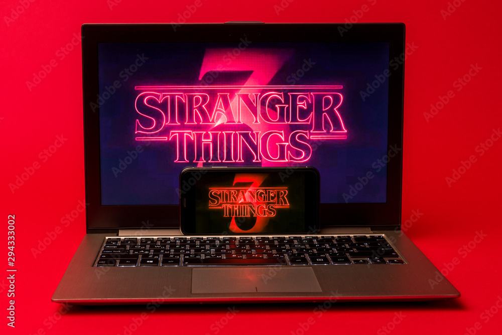 TULA, RUSSIA -AUGUST 19 2019: Stranger Things 3 from Netflix TV series  Poster, the iphone X and laptop with shot of Stranger Things Season 3  Photos | Adobe Stock