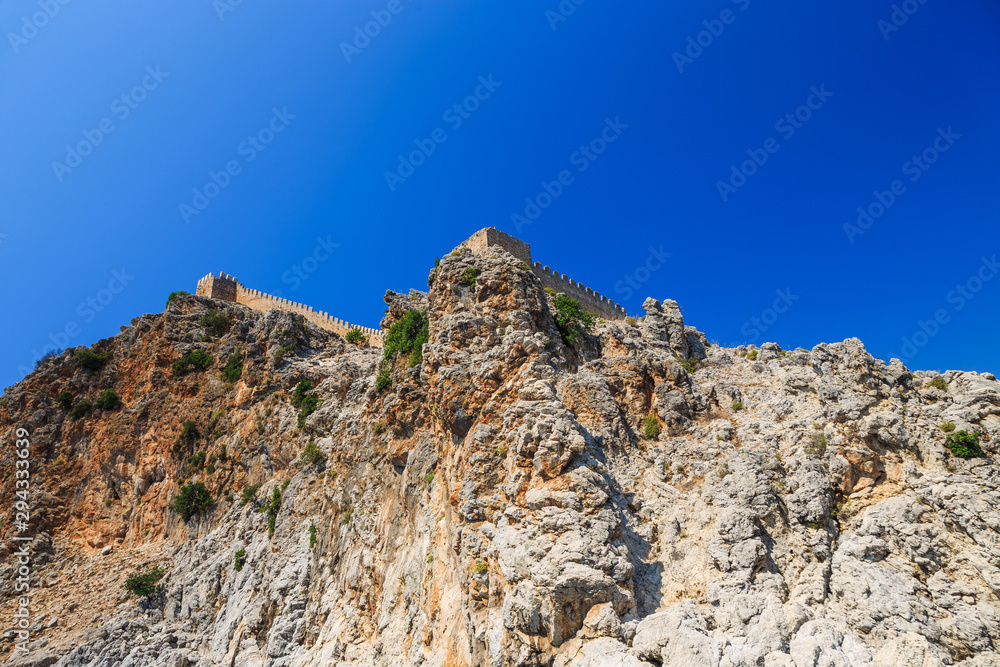 Rocks and the medieval fortress of Alanya, Turkey