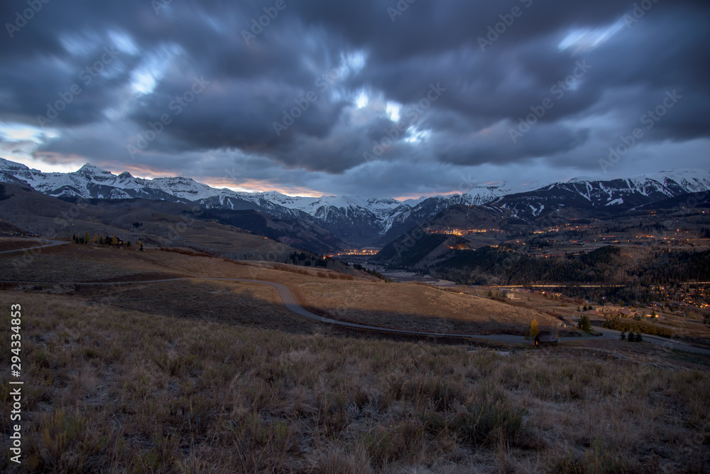 View of Colorado Mountain Town of Ouray at sunrise with cloud storm View of Colorado Mountain Town of Ouray at sunrise with cloud storm