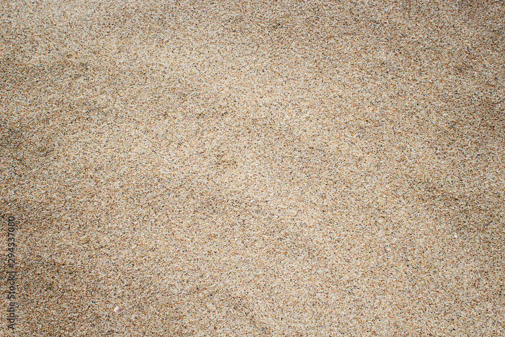 Fine sand texture. Brown sand background. Top view Fine sand texture. Brown sand background. Top view