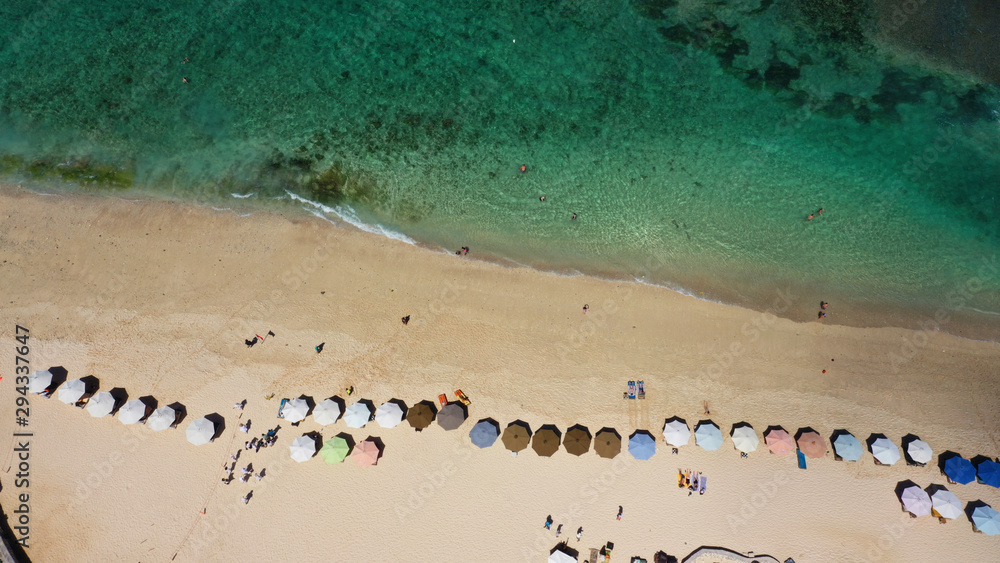 Beach written in sand on the beach, Melasti Beach, Bali.