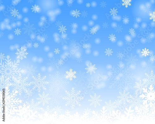 Christmas snow. Falling snowflakes on a blue background. Snowfall. 