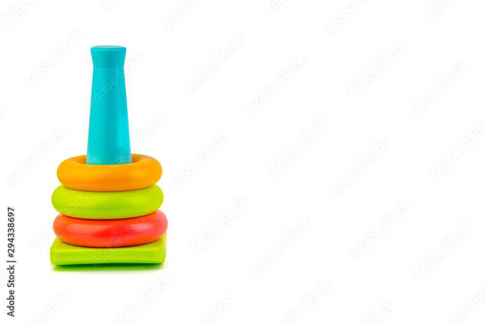 Plastic toy pyramid on a white background. Games and Copy space concept Plastic toy pyramid on a white background. Games and Copy space concept