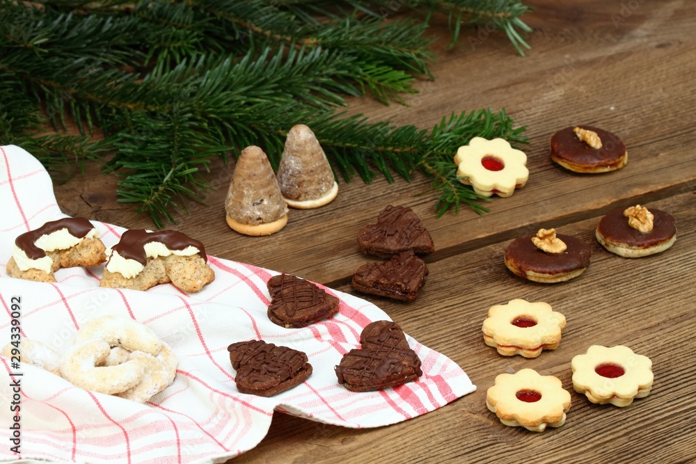 Christmas cookies made at home. Various xmas shortbread cookies on the brown wooden table. Typical for central Europe.
