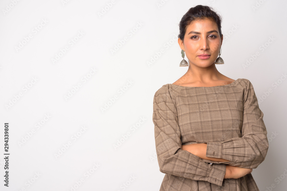 Portrait of young beautiful Persian woman with arms crossed Portrait of young beautiful Persian woman with arms crossed