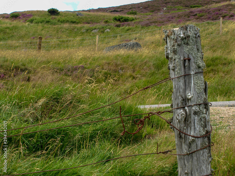 old wooden pole with wires, old yard in mountain pastures
