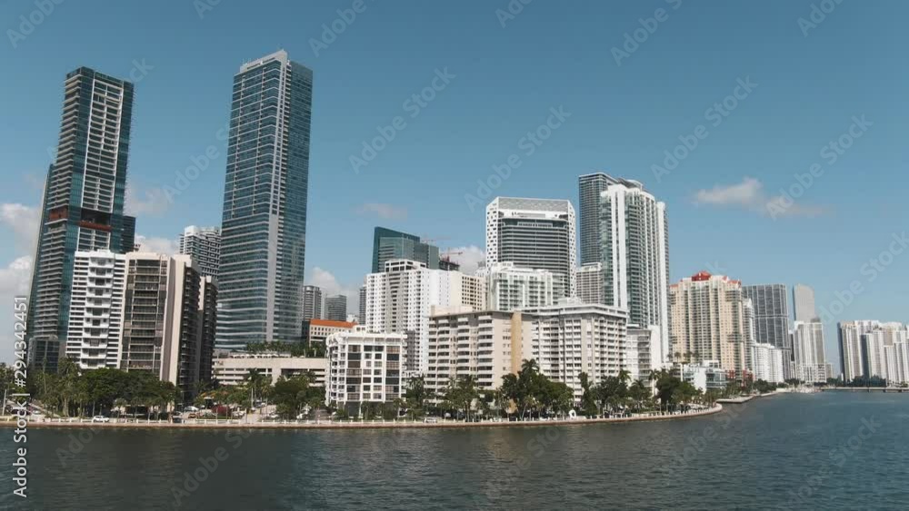 Low parallaxing drone shot of Brickell buildings on downtown Miami waterfront skyline 4K Low parallaxing drone shot of Brickell buildings on downtown Miami waterfront skyline 4K