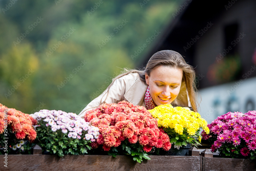 Naklejka premium portrait of young woman in autumn park. Autumn or spring travel woman