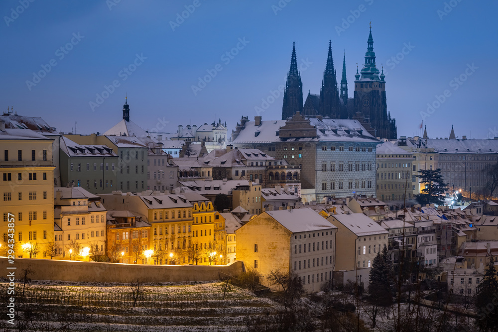 Prague Castle at night during snowy winter