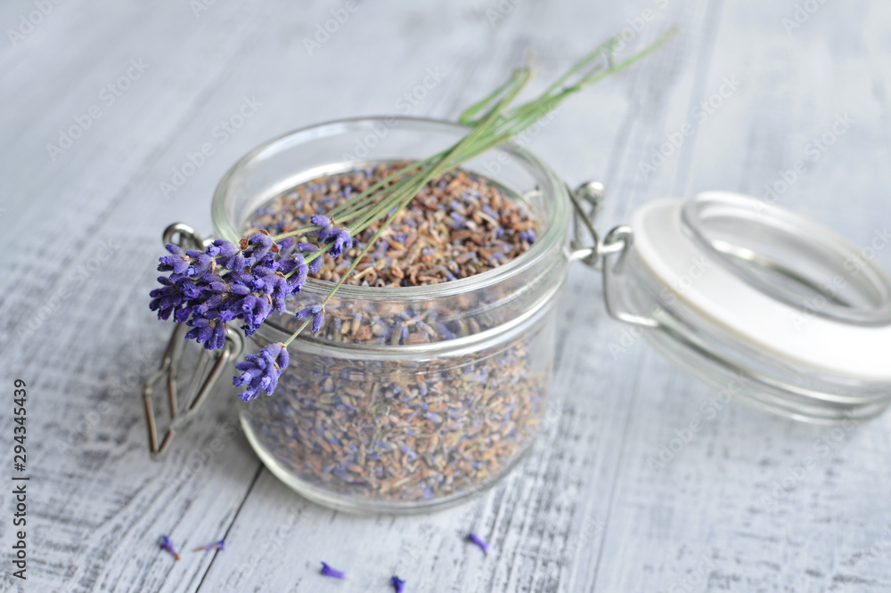 a bouquet of lavender flowers and dried lavender flowers in a glass jar close-up a bouquet of lavender flowers and dried lavender flowers in a glass jar close-up