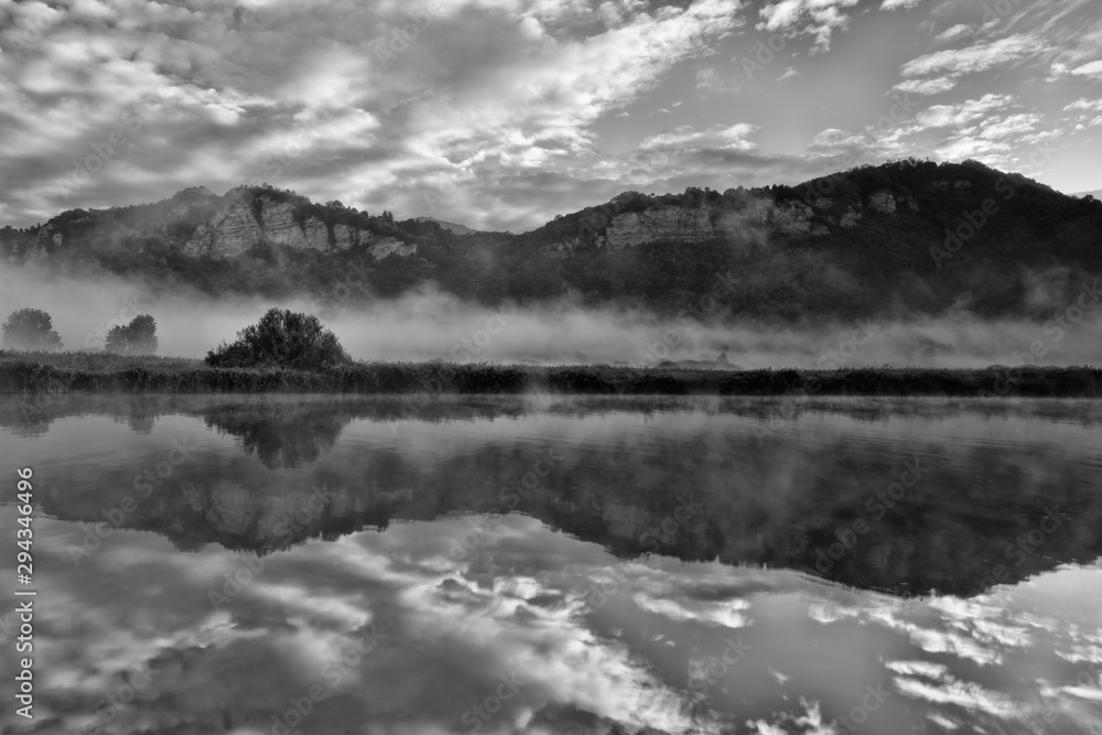 Fototapeta premium Reflection on the river at sunrise