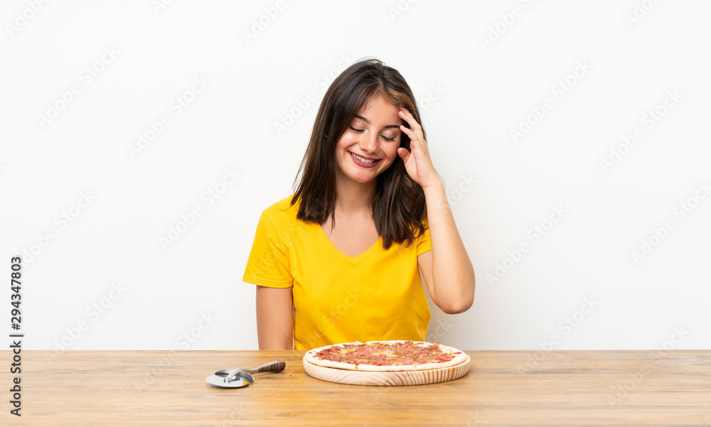 Caucasian girl with a pizza laughing Caucasian girl with a pizza laughing