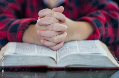 Little boy reading the Holy Bible.